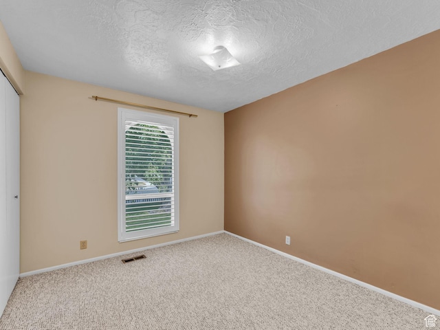 12580 S Janice Dr, Riverton, UT 84065 - spare room featuring carpet floors and a textured ceiling