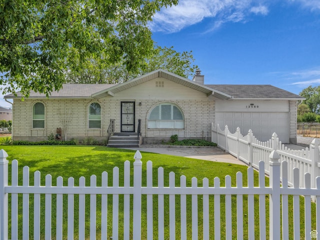 12580 S Janice Dr, Riverton, UT 84065 - ranch-style home with a fenced front yard, a garage, driveway, and a chimney