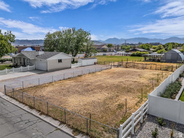 12580 S Janice Dr, Riverton, UT 84065 - view of yard with a mountain view, driveway, and a garage