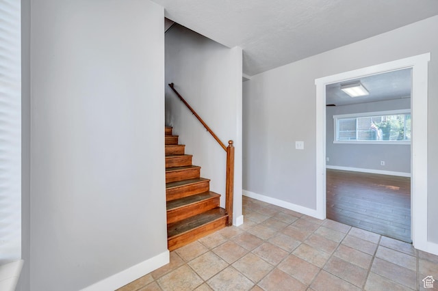 4940 S Atwood Blvd, Murray, UT 84107 - stairway featuring baseboards