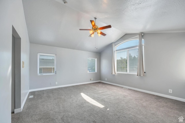 4940 S Atwood Blvd, Murray, UT 84107 - carpeted spare room with vaulted ceiling, ceiling fan, and a textured ceiling