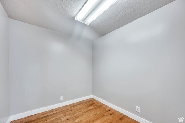 4940 S Atwood Blvd, Murray, UT 84107 - unfurnished room with a textured ceiling and light wood-style floors