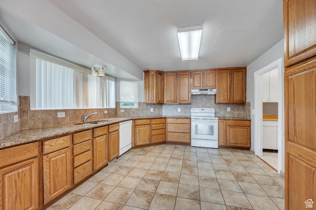 4940 S Atwood Blvd, Murray, UT 84107 - kitchen featuring white appliances, under cabinet range hood, tasteful backsplash, and light stone countertops