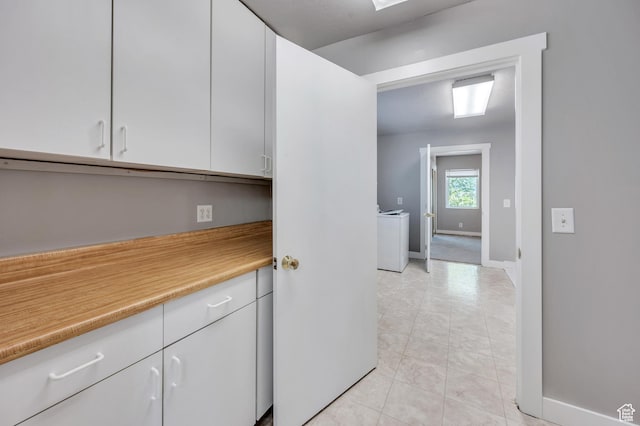 4940 S Atwood Blvd, Murray, UT 84107 - kitchen featuring white cabinets, light countertops, and light tile patterned floors