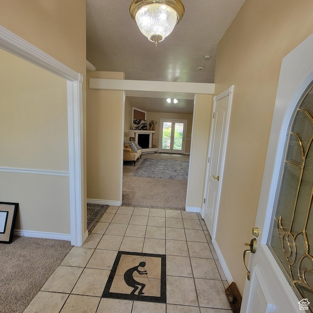 5272 S 1035 E, South Ogden, UT 84403 - hallway featuring light colored carpet, vaulted ceiling, and light tile patterned floors