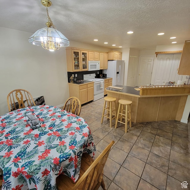 5272 S 1035 E, South Ogden, UT 84403 - dining space featuring recessed lighting, a textured ceiling, light tile patterned flooring, and a chandelier