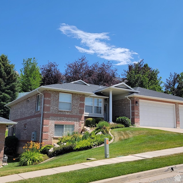 5272 S 1035 E, South Ogden, UT 84403 - ranch-style home featuring a garage, a front yard, brick siding, and concrete driveway