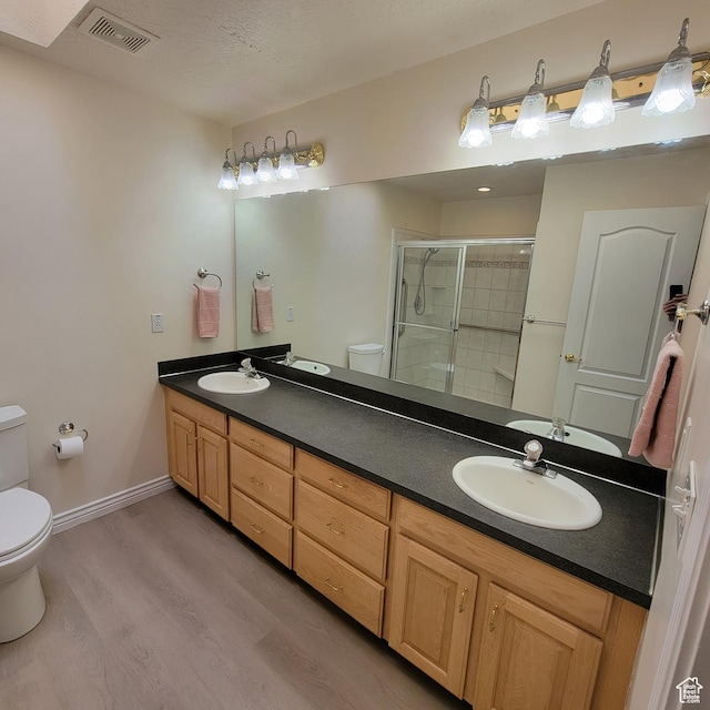 5272 S 1035 E, South Ogden, UT 84403 - bathroom with a stall shower, wood finished floors, and double vanity