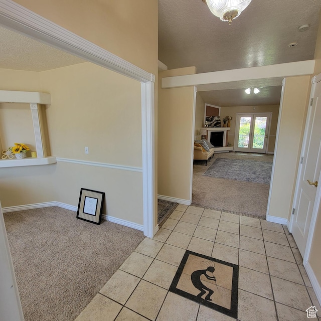 5272 S 1035 E, South Ogden, UT 84403 - foyer entrance with light colored carpet, a textured ceiling, and light tile patterned floors