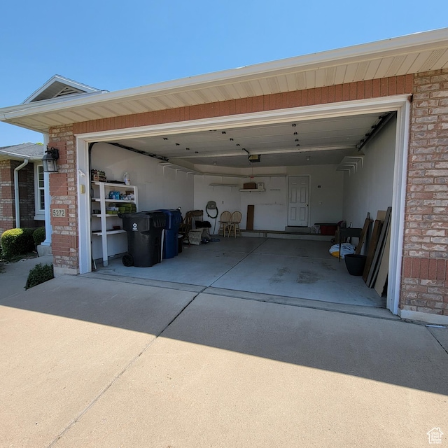 5272 S 1035 E, South Ogden, UT 84403 - garage featuring concrete driveway and a garage door opener