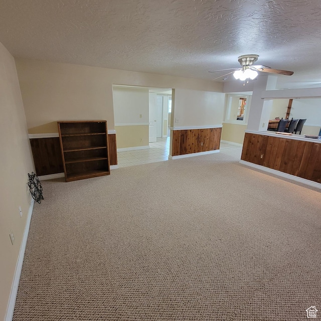 5272 S 1035 E, South Ogden, UT 84403 - unfurnished living room with ceiling fan, a textured ceiling, and light carpet