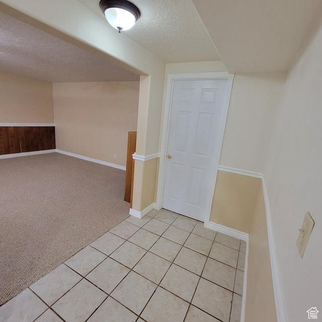 5272 S 1035 E, South Ogden, UT 84403 - unfurnished room featuring light carpet, a textured ceiling, and light tile patterned floors
