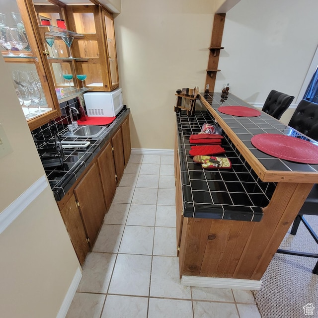 5272 S 1035 E, South Ogden, UT 84403 - bar featuring white microwave, light tile patterned floors, and tasteful backsplash