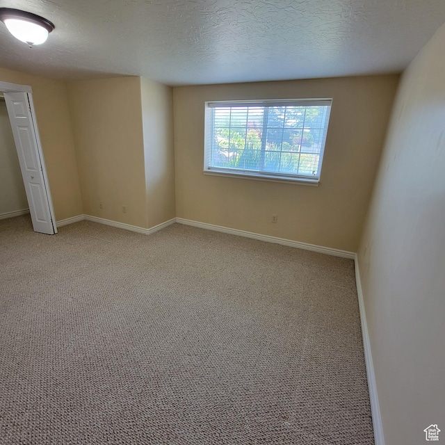 5272 S 1035 E, South Ogden, UT 84403 - spare room featuring light carpet and a textured ceiling