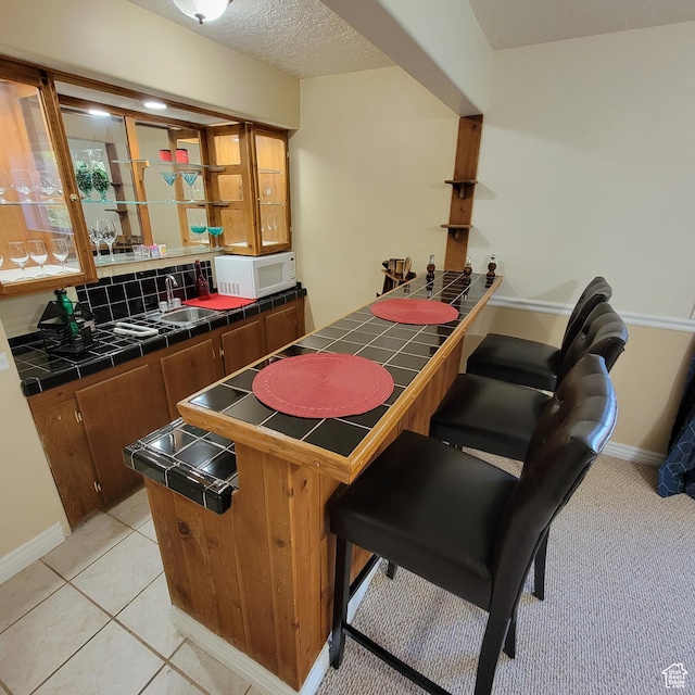 5272 S 1035 E, South Ogden, UT 84403 - indoor wet bar featuring white microwave and baseboards