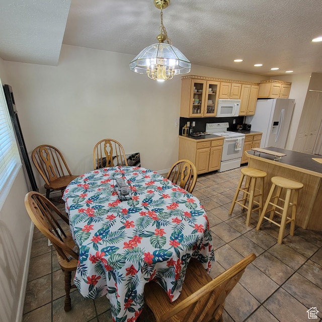 5272 S 1035 E, South Ogden, UT 84403 - dining area featuring a chandelier, light tile patterned floors, recessed lighting, and a textured ceiling
