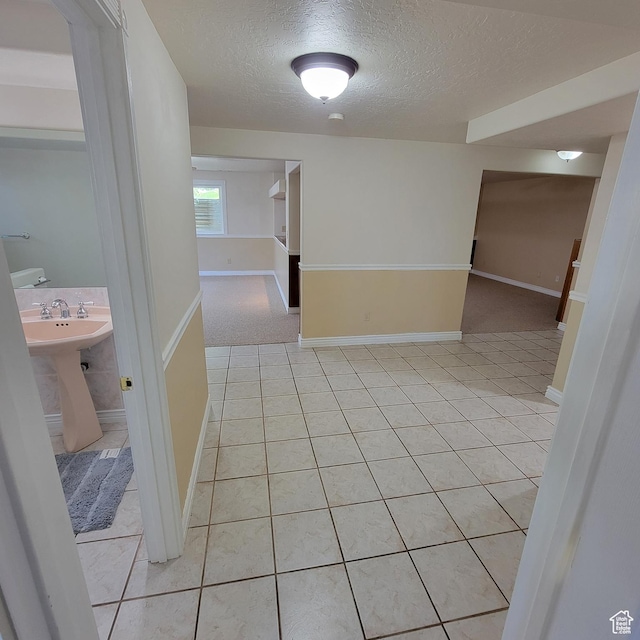 5272 S 1035 E, South Ogden, UT 84403 - corridor with a textured ceiling and light tile patterned flooring