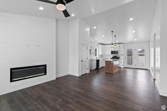 837 N 980 W Unit 66, Tremonton, UT 84337 - unfurnished living room featuring a fireplace, a ceiling fan, vaulted ceiling, recessed lighting, and dark wood finished floors