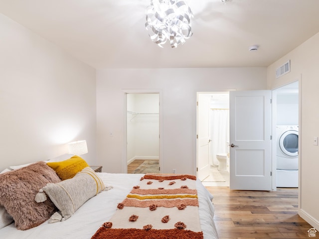 531 S 900 E Unit B3, Salt Lake City, UT 84102 - bedroom with light wood finished floors, washer / dryer, a chandelier, a spacious closet, and ensuite bath