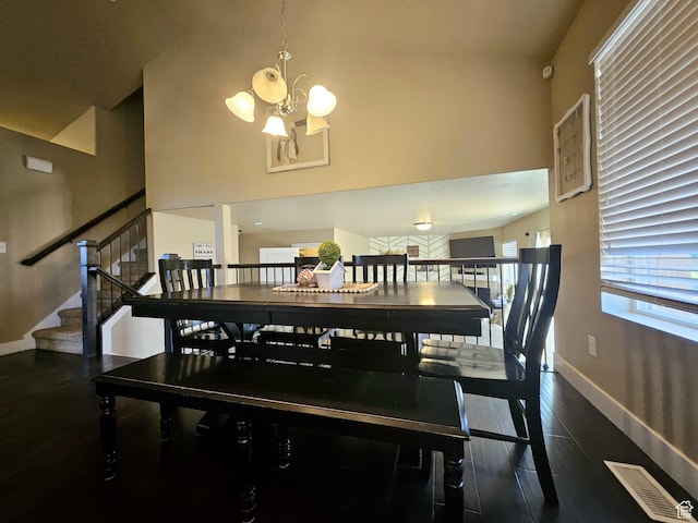 2175 E 1000 N, Ballard, UT 84066 - dining area featuring a chandelier, a high ceiling, stairs, and wood finished floors