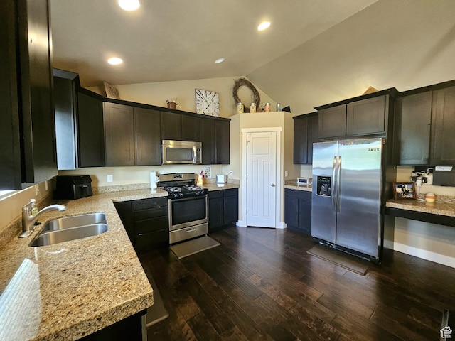 2175 E 1000 N, Ballard, UT 84066 - kitchen with appliances with stainless steel finishes, dark wood-style flooring, light countertops, high vaulted ceiling, and dark brown cabinetry