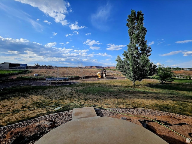 2175 E 1000 N, Ballard, UT 84066 - view of green lawn with a trampoline