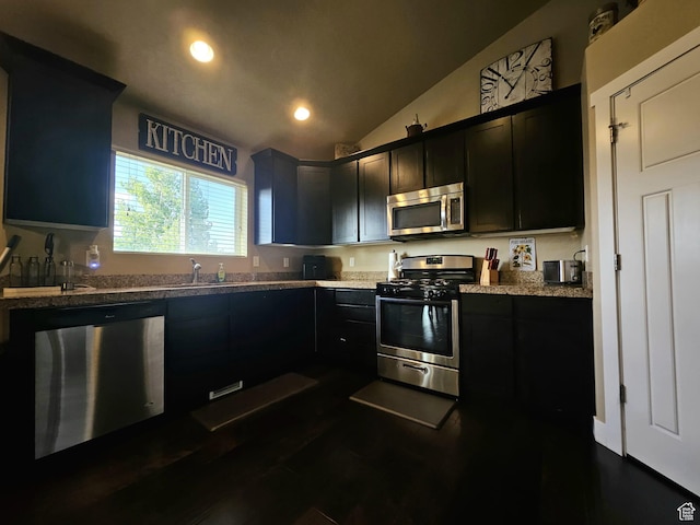 2175 E 1000 N, Ballard, UT 84066 - kitchen with appliances with stainless steel finishes, dark cabinets, lofted ceiling, recessed lighting, and dark wood-style flooring