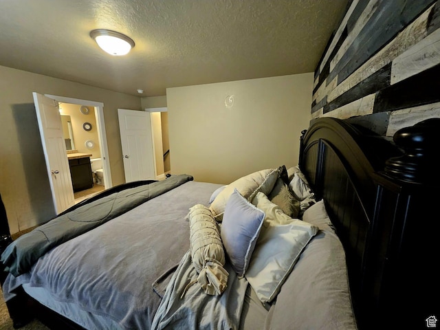 2175 E 1000 N, Ballard, UT 84066 - bedroom featuring a textured ceiling and connected bathroom