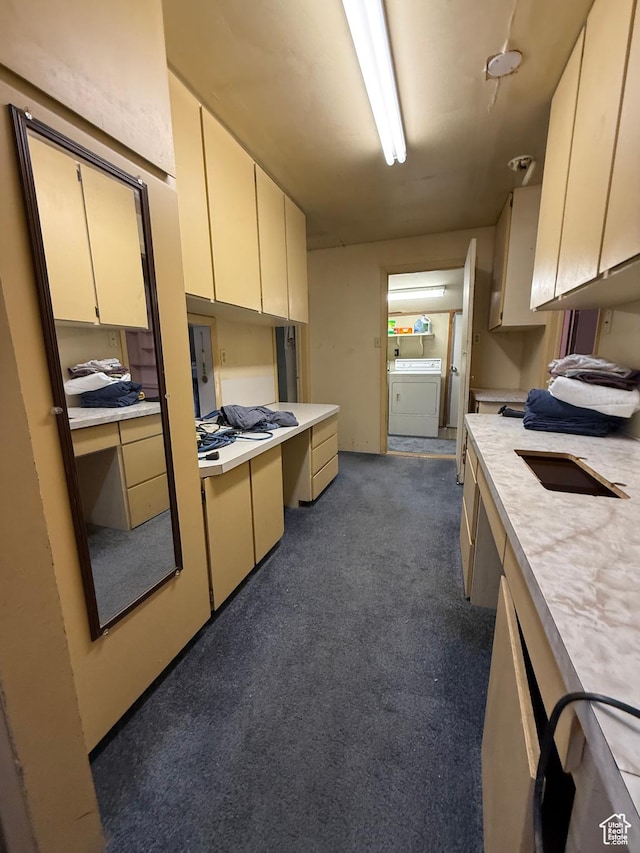 539 E Center St, Pleasant Grove, UT 84062 - kitchen featuring light countertops, dark colored carpet, washer and clothes dryer, and cream cabinets