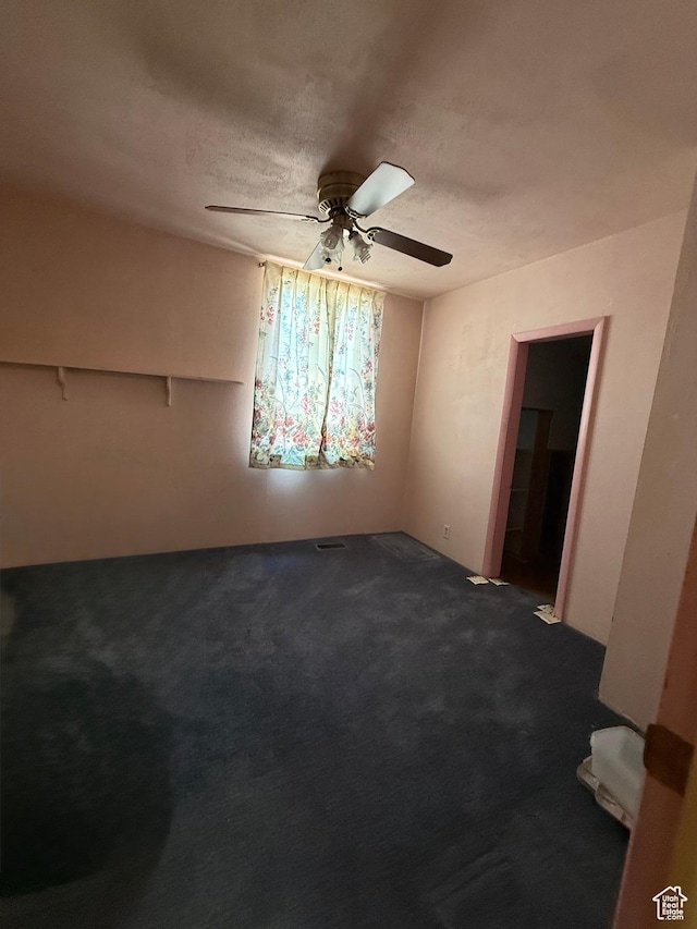 539 E Center St, Pleasant Grove, UT 84062 - empty room featuring ceiling fan, dark carpet, and a textured ceiling