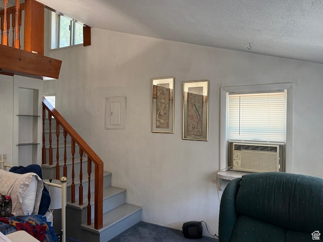 539 E Center St, Pleasant Grove, UT 84062 - stairs featuring lofted ceiling, electric panel, a textured ceiling, and carpet