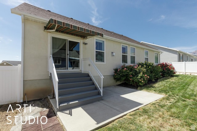 1608 N 500 E, North Ogden, UT 84404 - back of property featuring a patio, stucco siding, and entry steps