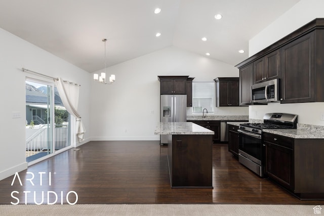 1608 N 500 E, North Ogden, UT 84404 - kitchen with stainless steel appliances, plenty of natural light, dark brown cabinets, high vaulted ceiling, and recessed lighting