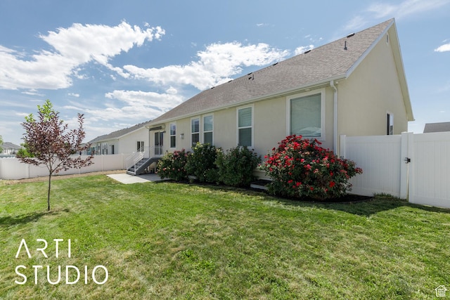 1608 N 500 E, North Ogden, UT 84404 - back of property featuring a fenced backyard, stucco siding, a gate, and roof with shingles