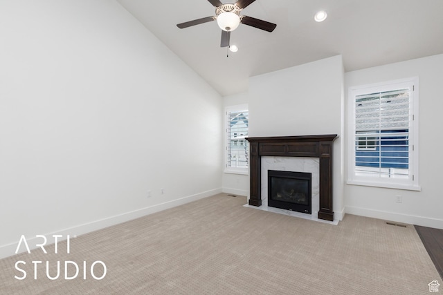 1608 N 500 E, North Ogden, UT 84404 - unfurnished living room featuring vaulted ceiling, a ceiling fan, a fireplace, recessed lighting, and carpet floors