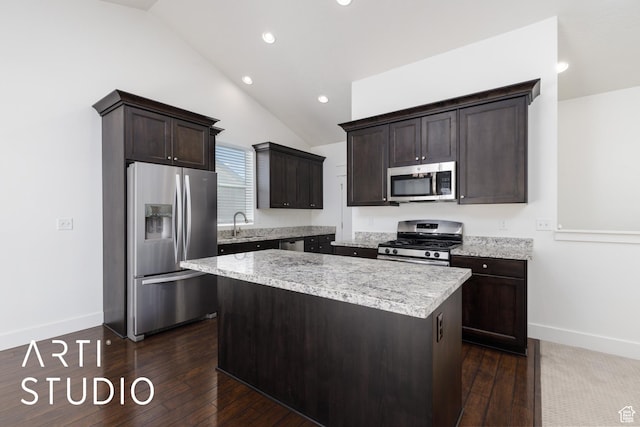 1608 N 500 E, North Ogden, UT 84404 - kitchen with stainless steel appliances, lofted ceiling, a kitchen island, dark brown cabinets, and dark wood-type flooring