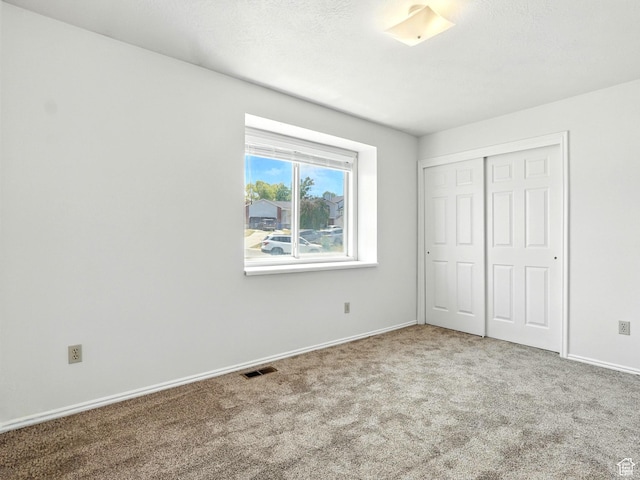 3992 S 4665 W, West Valley City, UT 84120 - unfurnished bedroom featuring carpet floors and a closet