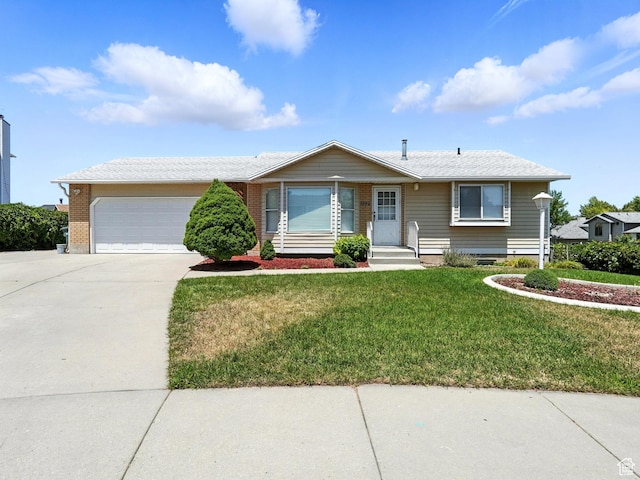 3992 S 4665 W, West Valley City, UT 84120 - ranch-style house featuring concrete driveway, a garage, and a front yard