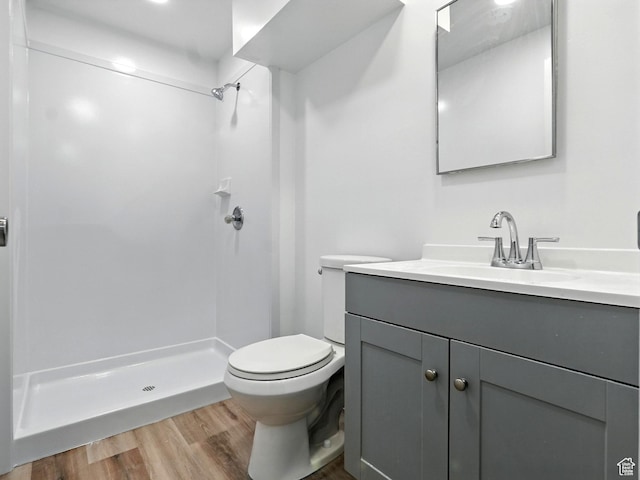 3992 S 4665 W, West Valley City, UT 84120 - bathroom featuring vanity, a stall shower, and wood finished floors
