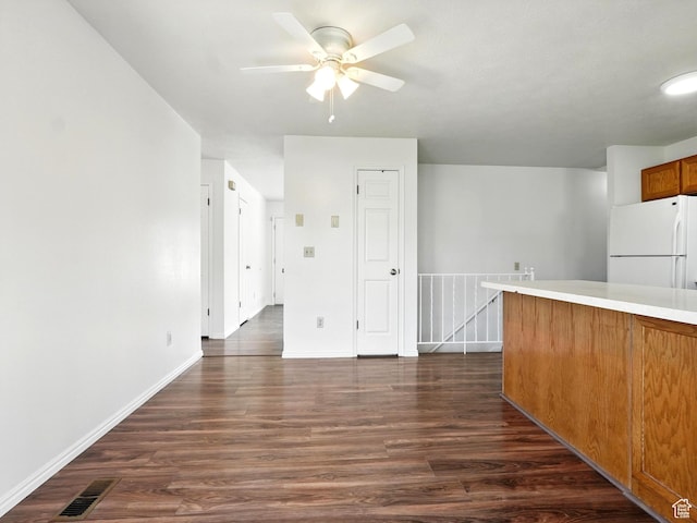 3992 S 4665 W, West Valley City, UT 84120 - unfurnished living room featuring a ceiling fan and dark wood-style flooring