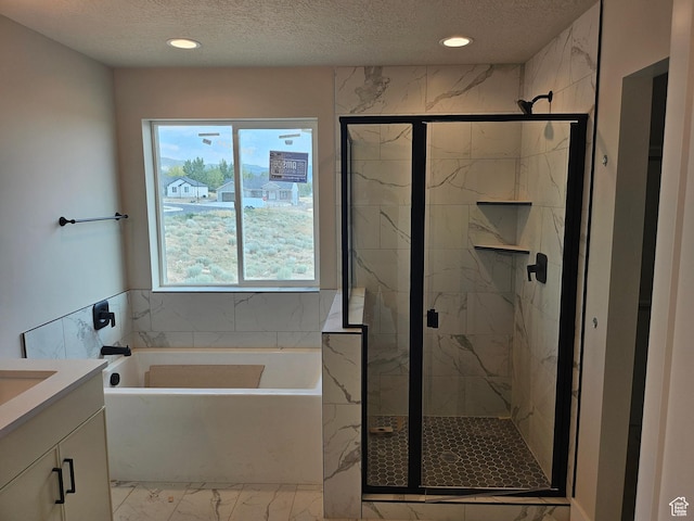 1569 N 300 E, Nephi, UT 84648 - bathroom with marble look tile flooring, a garden tub, a textured ceiling, vanity, and a marble finish shower