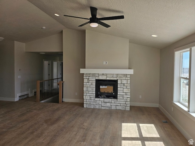 1569 N 300 E, Nephi, UT 84648 - unfurnished living room featuring wood finished floors, a textured ceiling, a ceiling fan, healthy amount of natural light, and vaulted ceiling