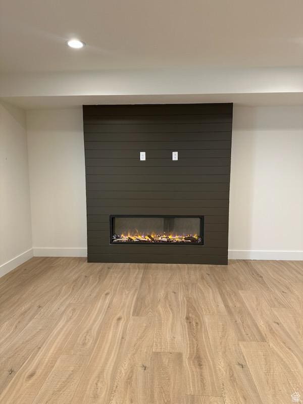 1361 S Lincoln St, Salt Lake City, UT 84105 - detailed view of a large fireplace, wood finished floors, and recessed lighting