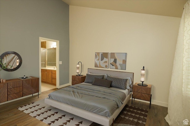 1141 E Murray Holladay Rd S, Millcreek, UT 84117 - bedroom with wood finished floors, a towering ceiling, and ensuite bathroom