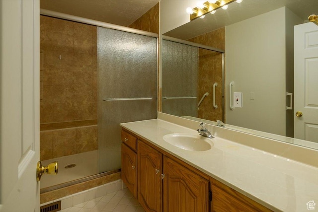 1141 E Murray Holladay Rd S, Millcreek, UT 84117 - bathroom with tile patterned floors, vanity, and a shower stall