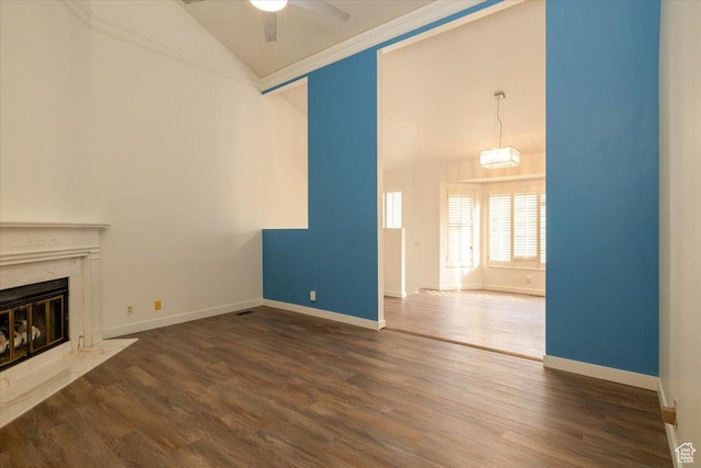 1141 E Murray Holladay Rd S, Millcreek, UT 84117 - unfurnished living room featuring a ceiling fan, wood finished floors, a fireplace, high vaulted ceiling, and crown molding