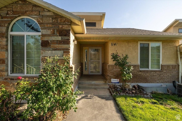 1141 E Murray Holladay Rd S, Millcreek, UT 84117 - doorway to property featuring stucco siding and brick siding
