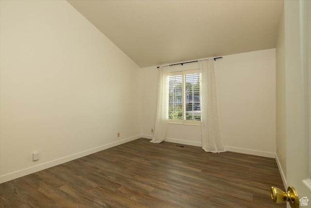 1141 E Murray Holladay Rd S, Millcreek, UT 84117 - unfurnished room featuring dark wood-style flooring and vaulted ceiling