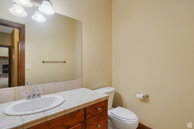 1321 E Farm Dr, Murray, UT 84117 - half bath featuring vanity and a stone fireplace