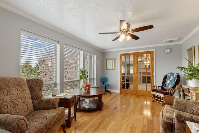 24725 N 11925 E, Fairview, UT 84629 - living area featuring a ceiling fan, light wood-type flooring, crown molding, and a textured ceiling